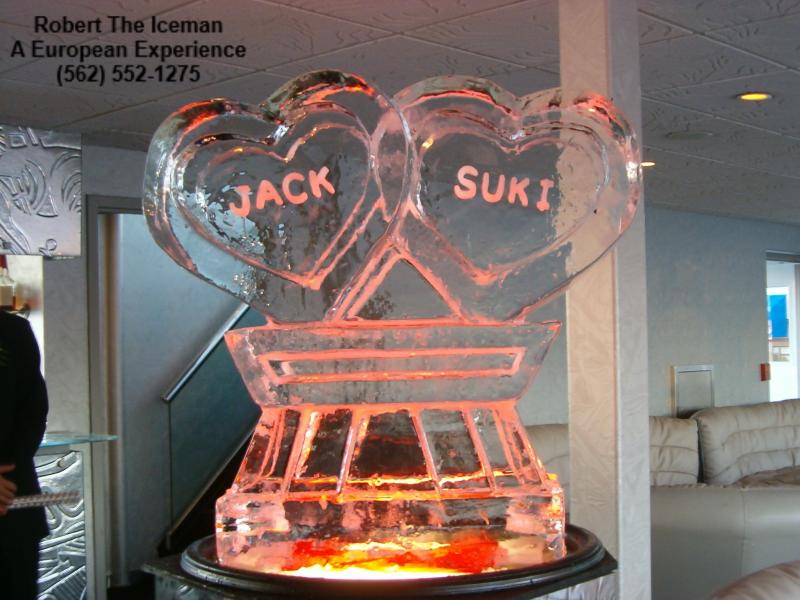 Interlocking hearts with names carved on a beautiful pedestal mermaid in the clamshell