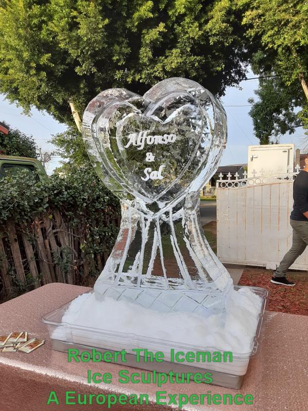 Heart on pedestal with names carved in the heart